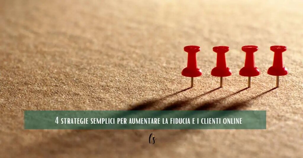 Quattro puntine rosse allineate che rappresentano 4 strategie per aumentare fiducia e clienti online